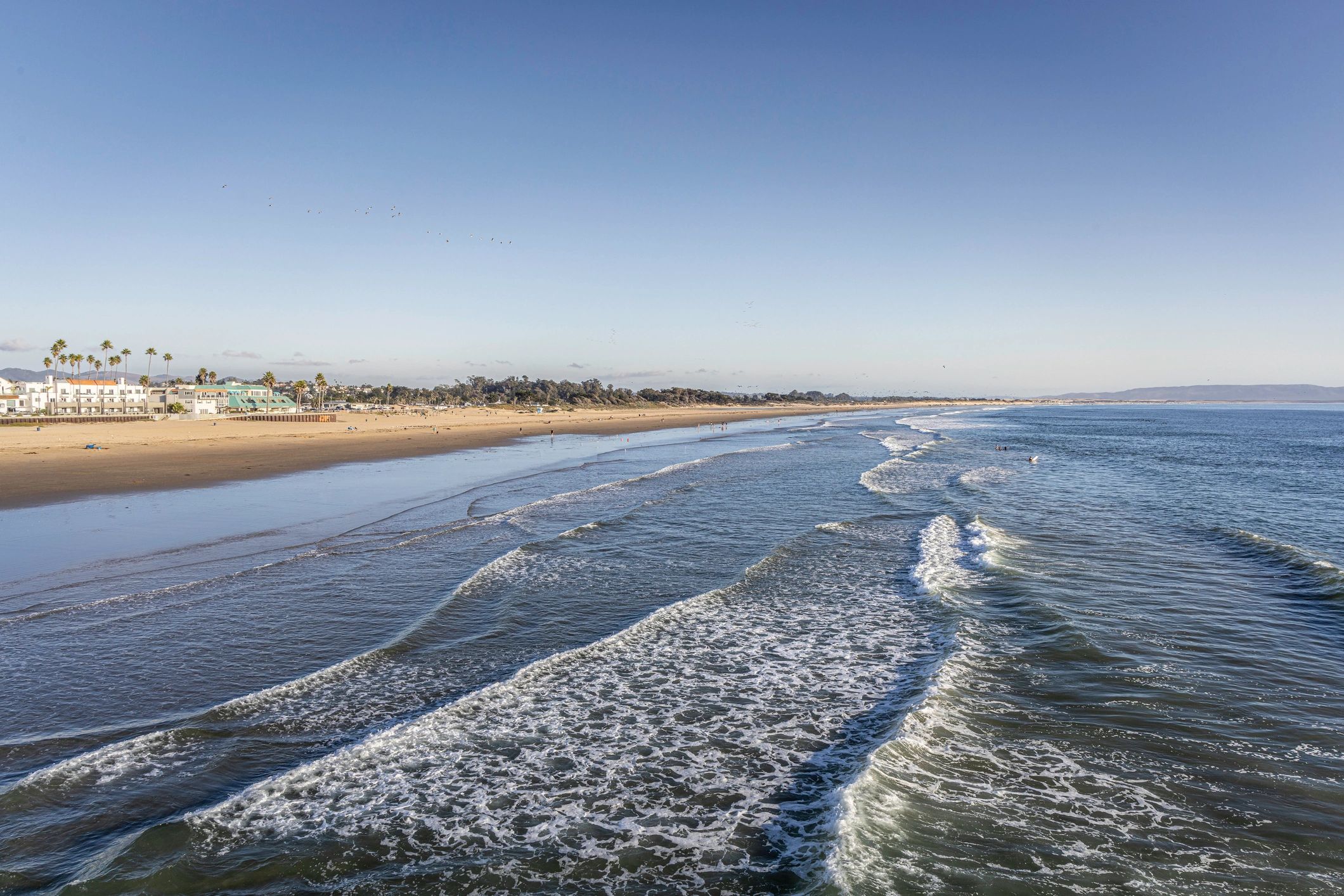 Wide sandy beach and calm ocean in California