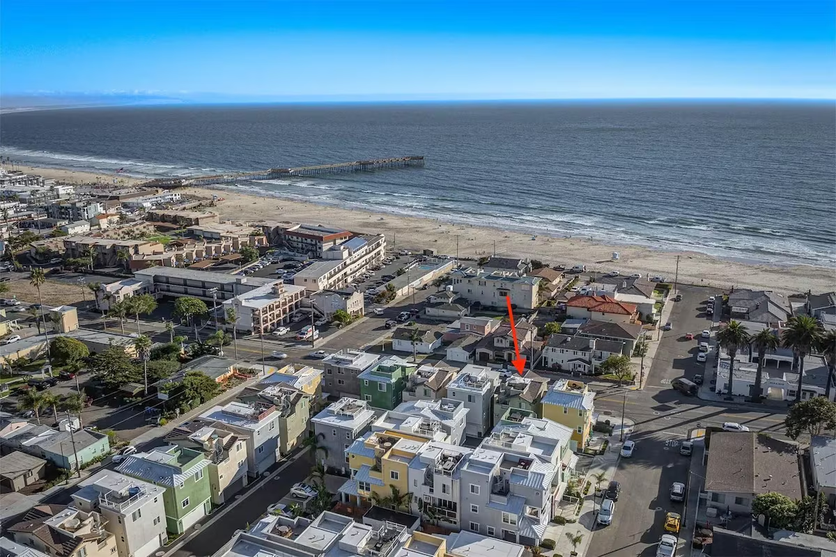 Golden sunset at Pismo Beach with fisherman on the shore and dramatic ocean views – perfect evening from your rooftop deck