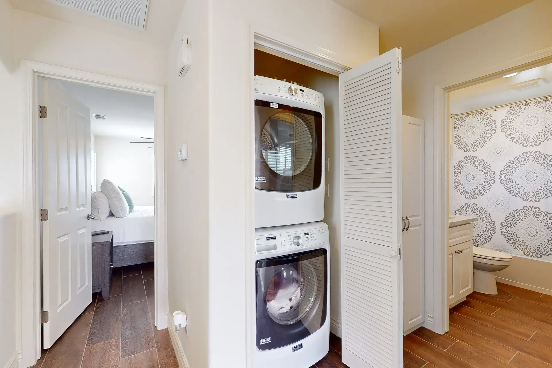 Laundry room with washer and dryer for guest use
